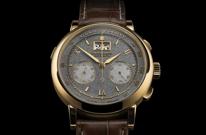 A luxury A. Lange & Söhne watch resting on a polished wooden surface.