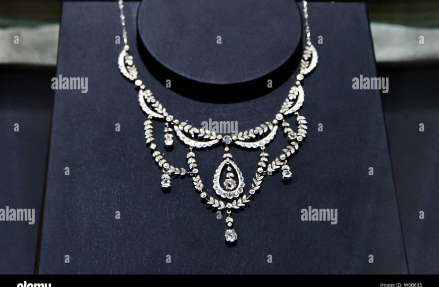 An exquisite diamond necklace displayed inside a high-end luxury jewelry boutique in London.