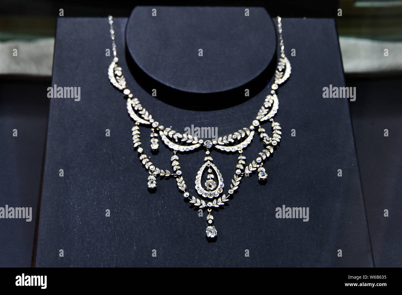 An exquisite diamond necklace displayed inside a high-end luxury jewelry boutique in London.