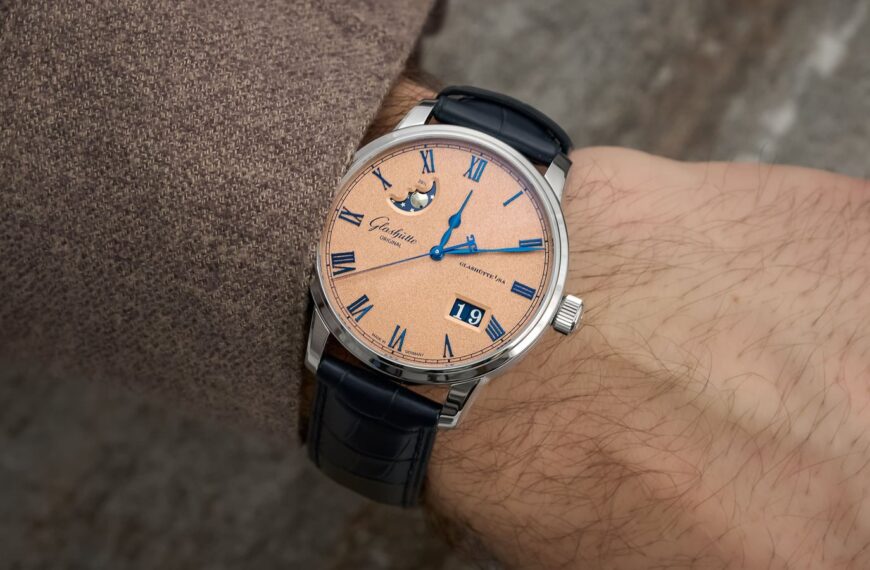 A luxury Glashütte Original watch sits on a desk showcasing fine German watchmaking.
