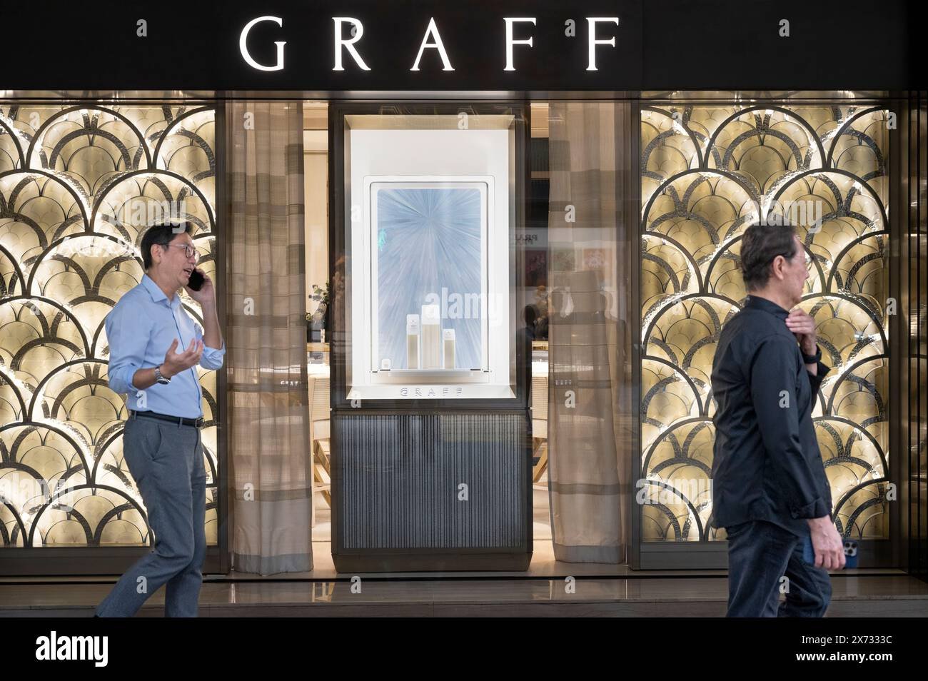 An exquisite diamond necklace displayed professionally within a luxury Graff jewelry boutique setting.