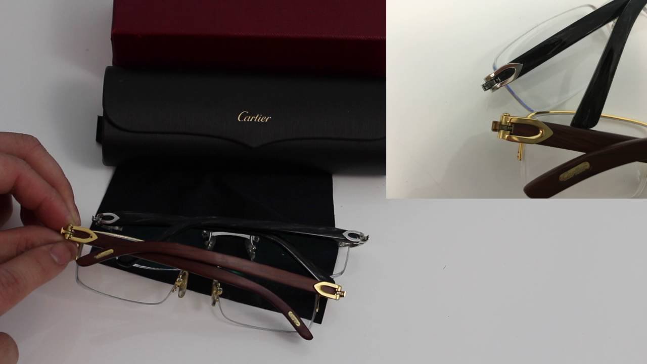 Authentic designer glasses displayed on a marble surface to help identify Cartier glasses.