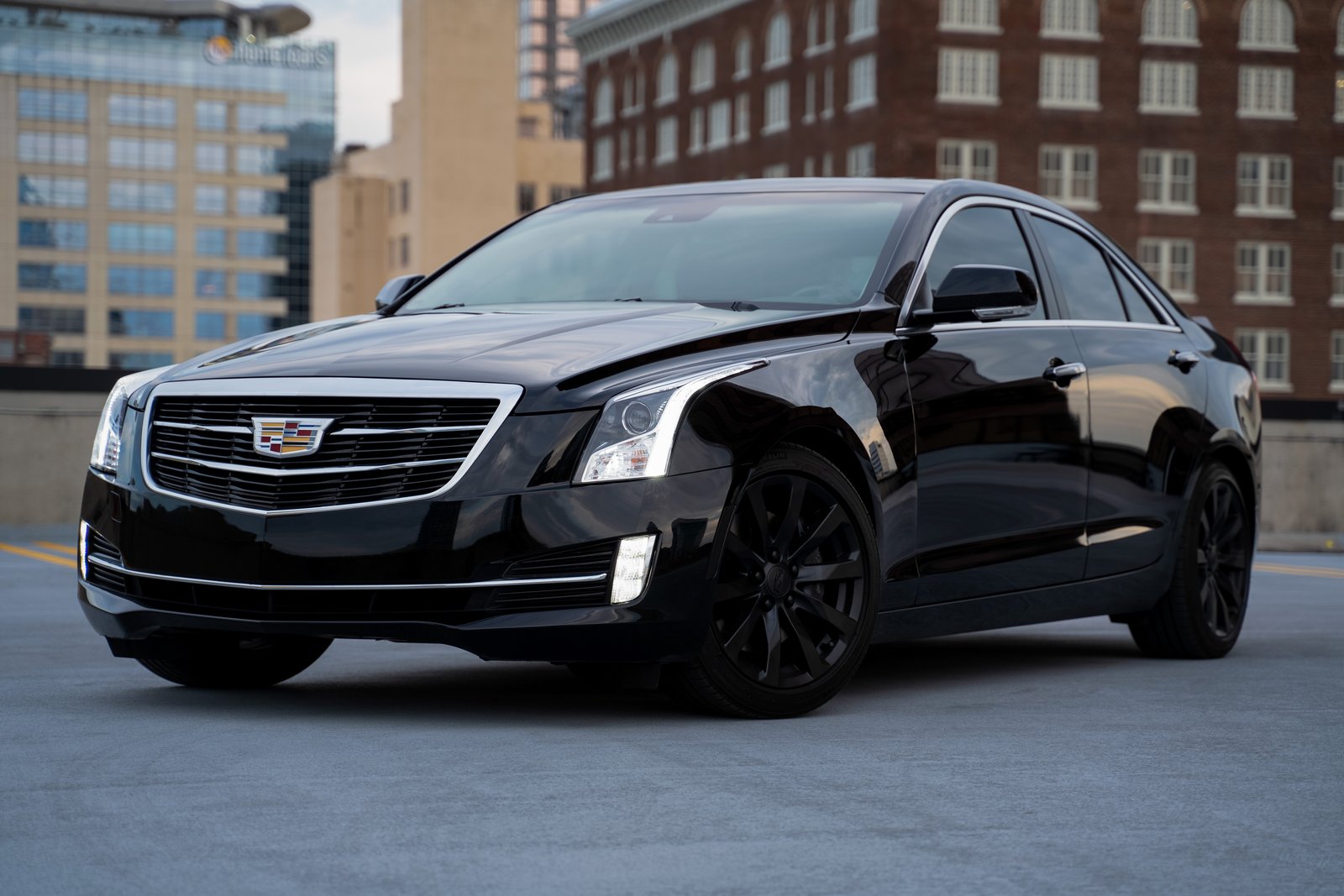 A classic Cadillac parked on a quiet street representing the long-lasting durability of luxury vehicles.