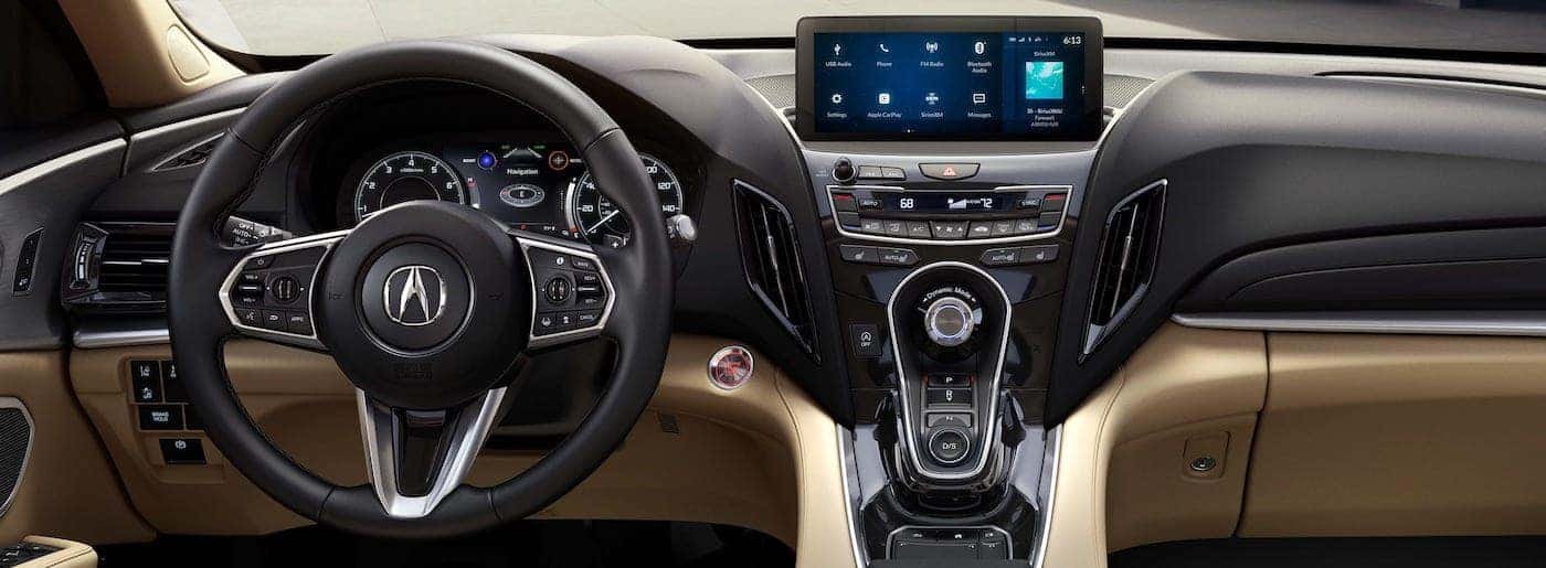 A close-up of a modern luxury vehicle dashboard displaying an Acura radio code prompt.