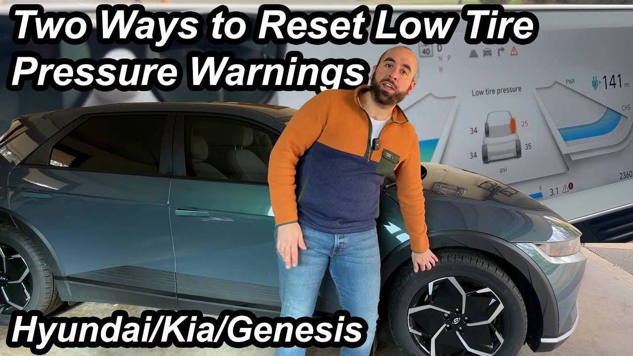 A glowing tire pressure warning light on a luxury car dashboard display.