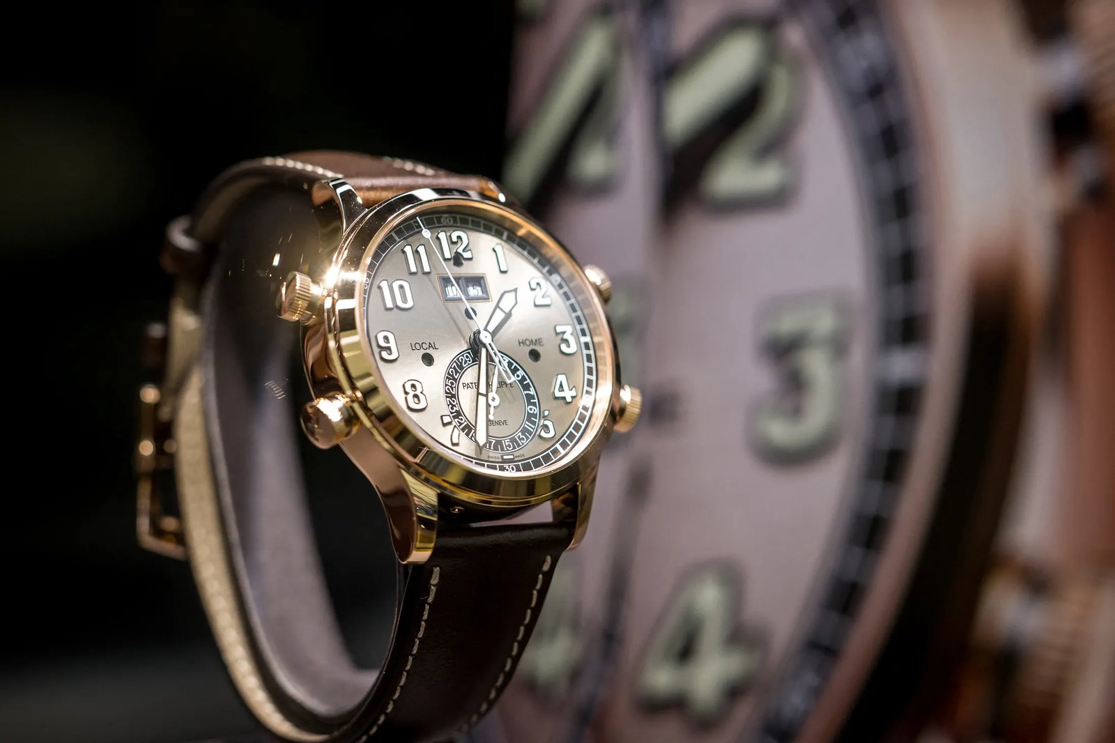Detailed view of the complex mechanical movement inside a Patek Philippe watch.